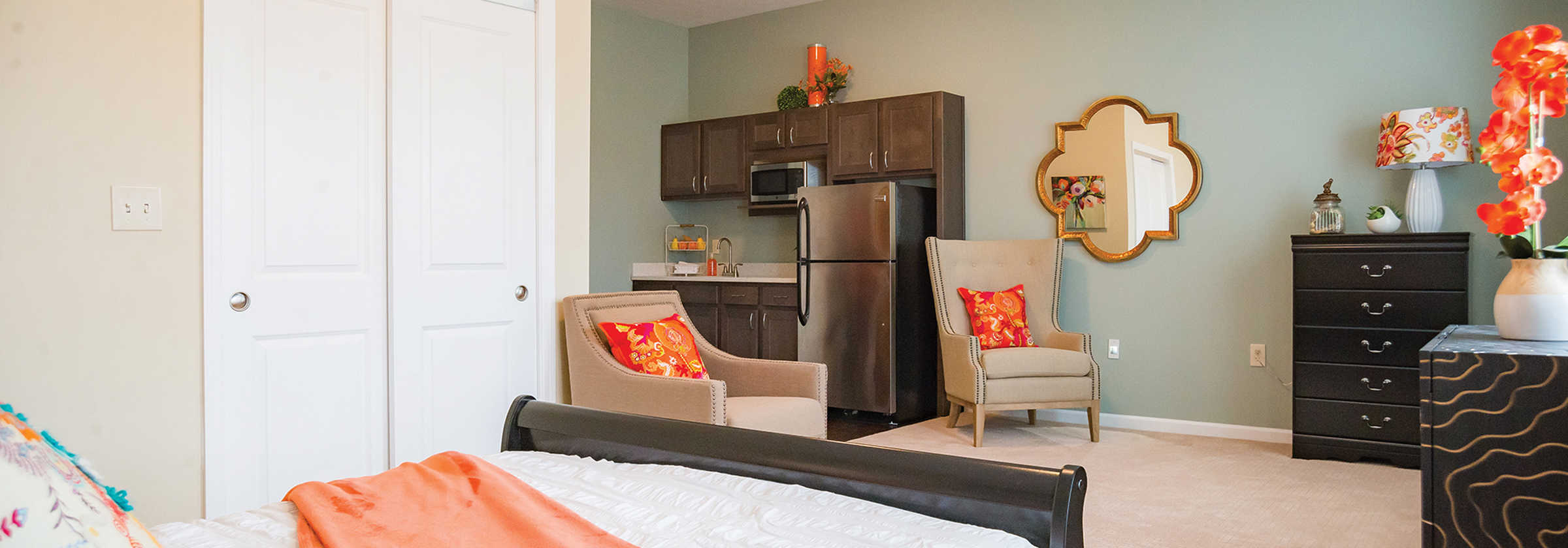 View of a decorated bedroom in a senior living apartment